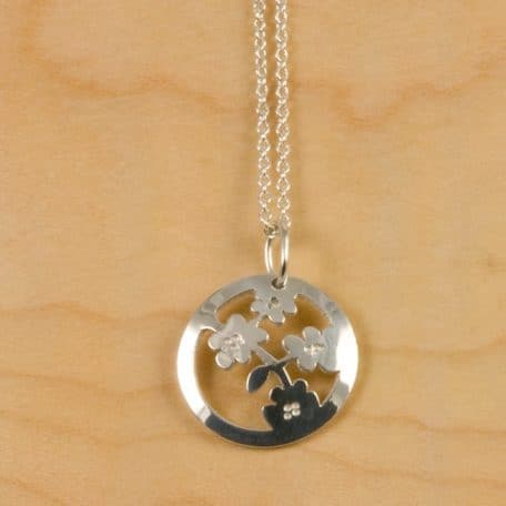 A pendant with a floral Nara Blossom design.