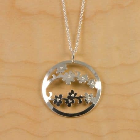 Sendai Blossom Pendant with floral centerpiece.