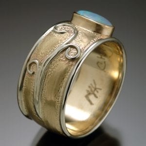 A custom gold ring with an opal stone.