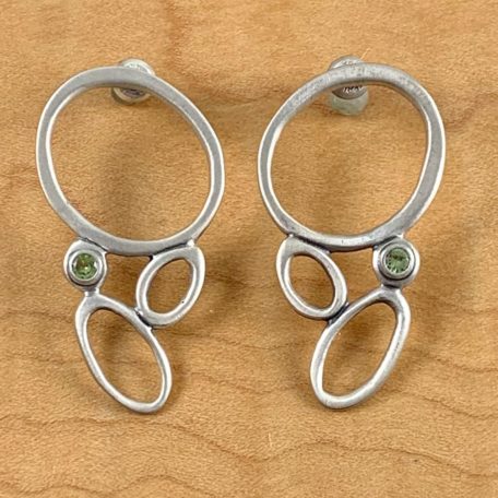 A pair of Sea Foam Earrings with peridot stones.
