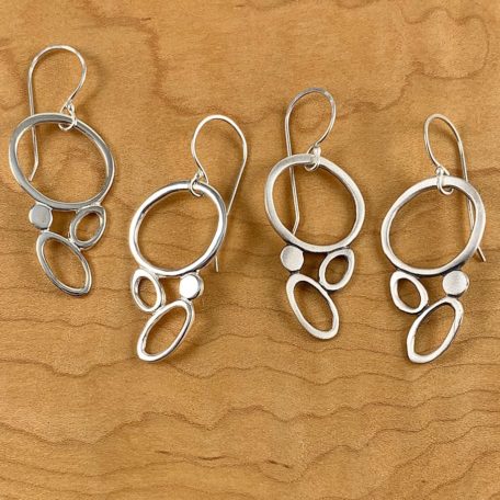 Three Sea Foam Earrings on surface.