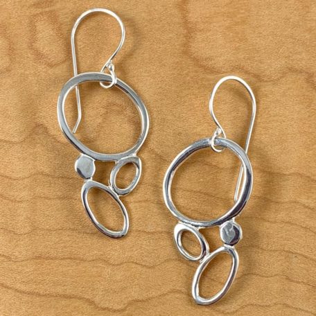 Sea Foam Earrings displayed on wooden surface.
