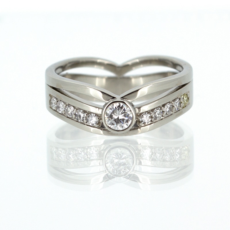 A custom white gold wedding ring with diamonds.