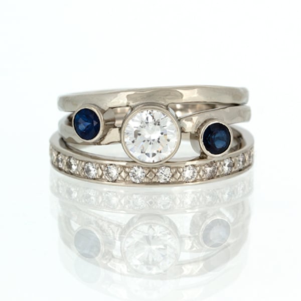 A custom white gold ring with sapphires and diamonds.