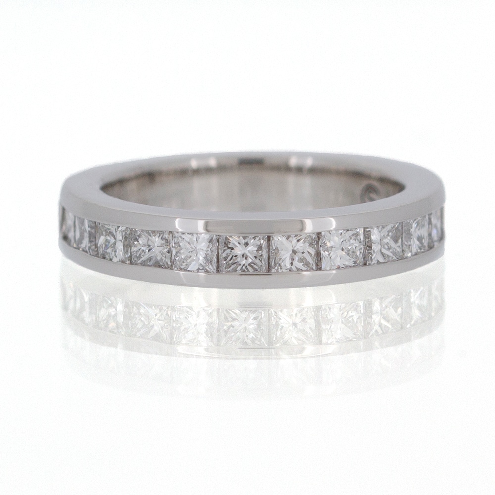 A princess cut diamond eternity ring in white gold.